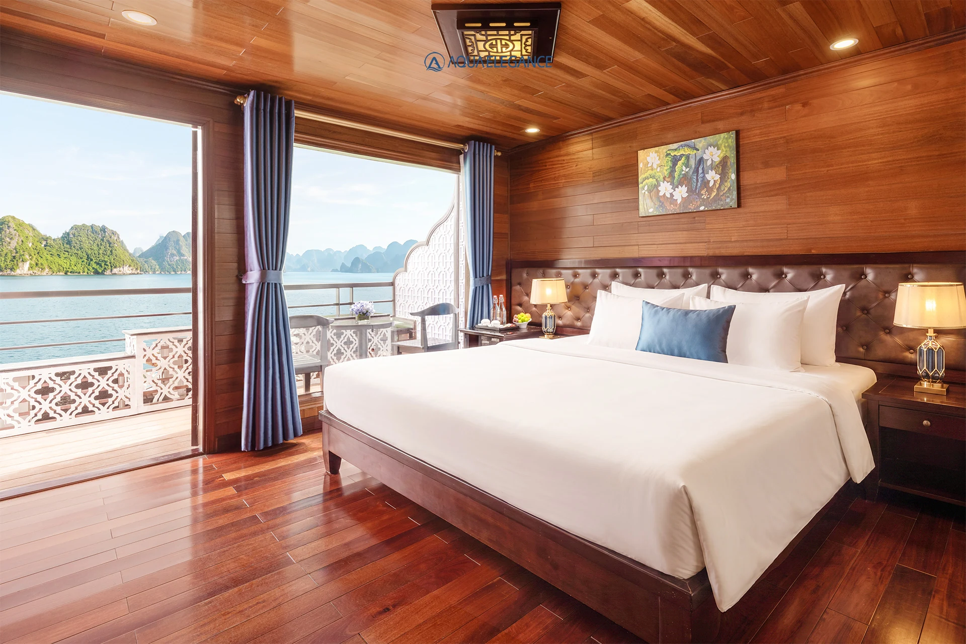 Grand Suite Balcony cabin with king bed and private balcony on Aqua Elegance Cruise