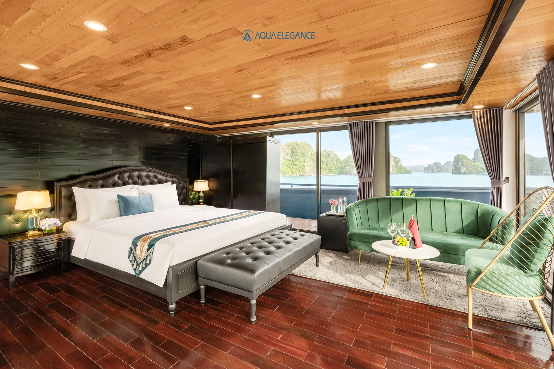President Suite Balcony cabin with a king bed, a sofa and large windows on Aqua Elegance Cruise