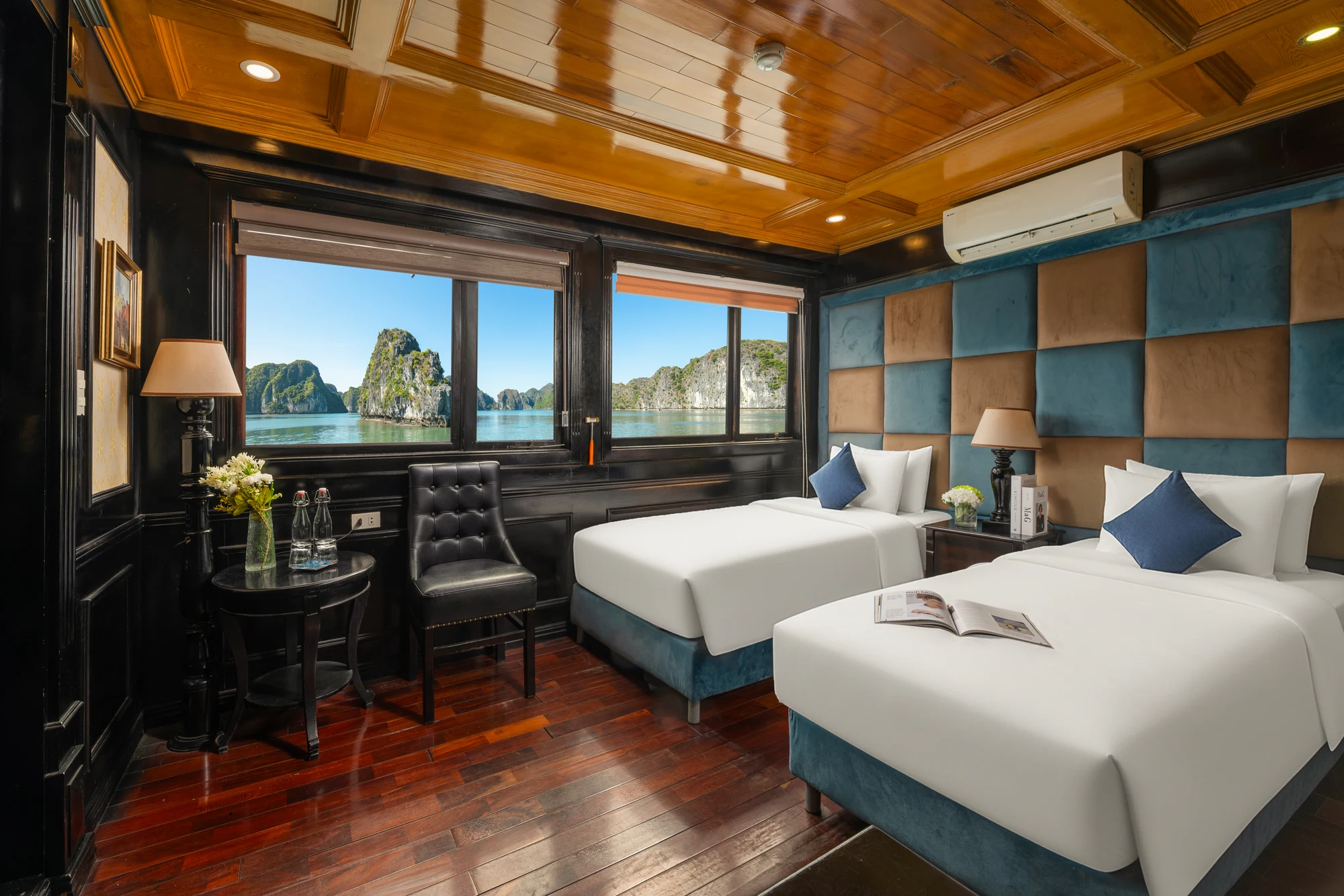 Deluxe Twin Ocean View cabin with two single beds and bay-view windows on Quiet Bay Cruise